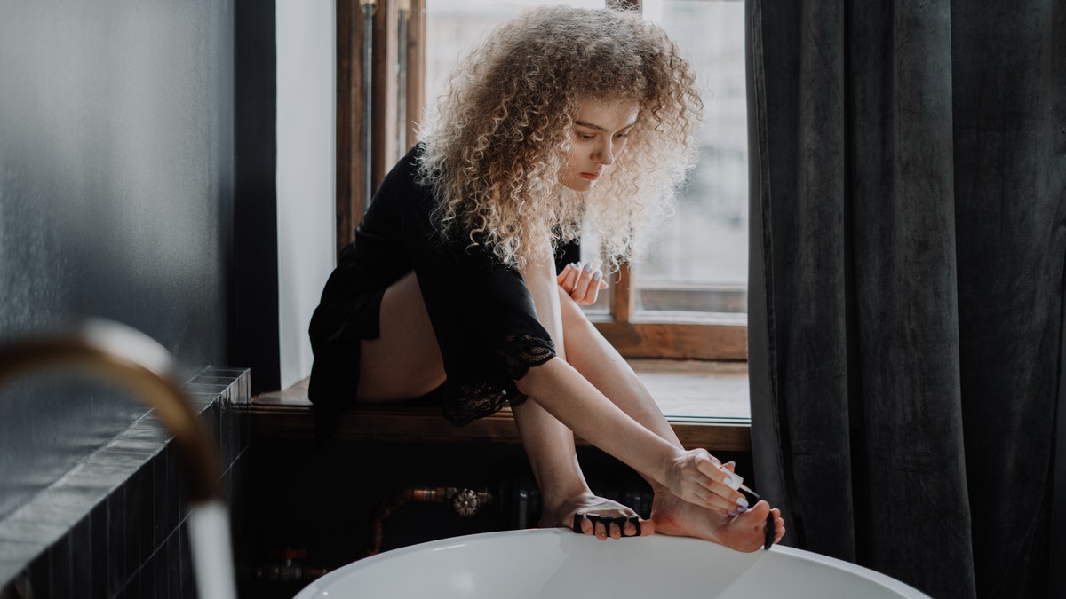 girl having pedicure