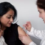 woman getting vaccinated