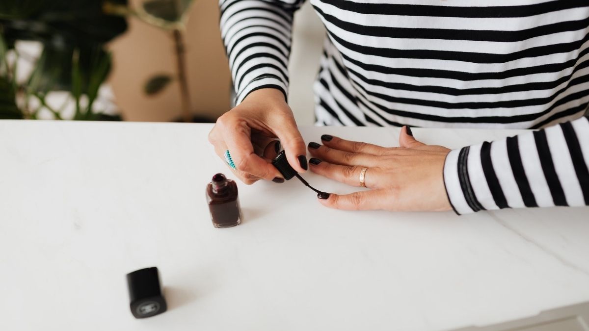 woman painting her nails