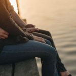 couple sitting by the sea