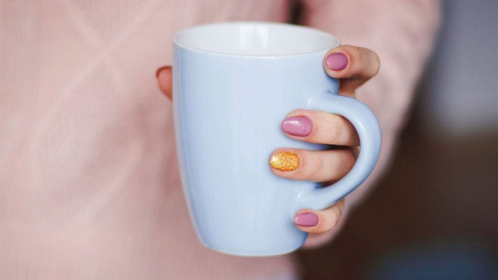 woman holding mug