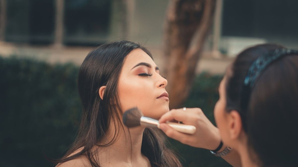 woman having her make up done