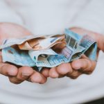 man holds money