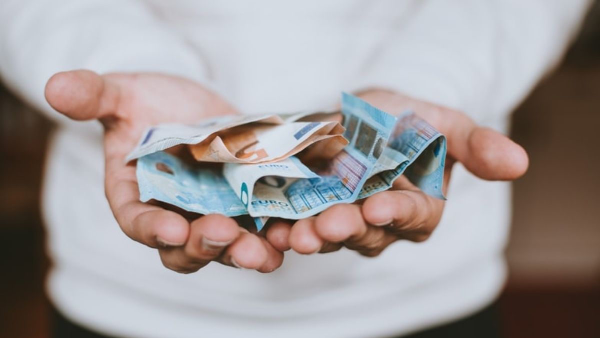 man holds money