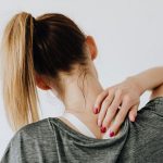 woman having neck pain