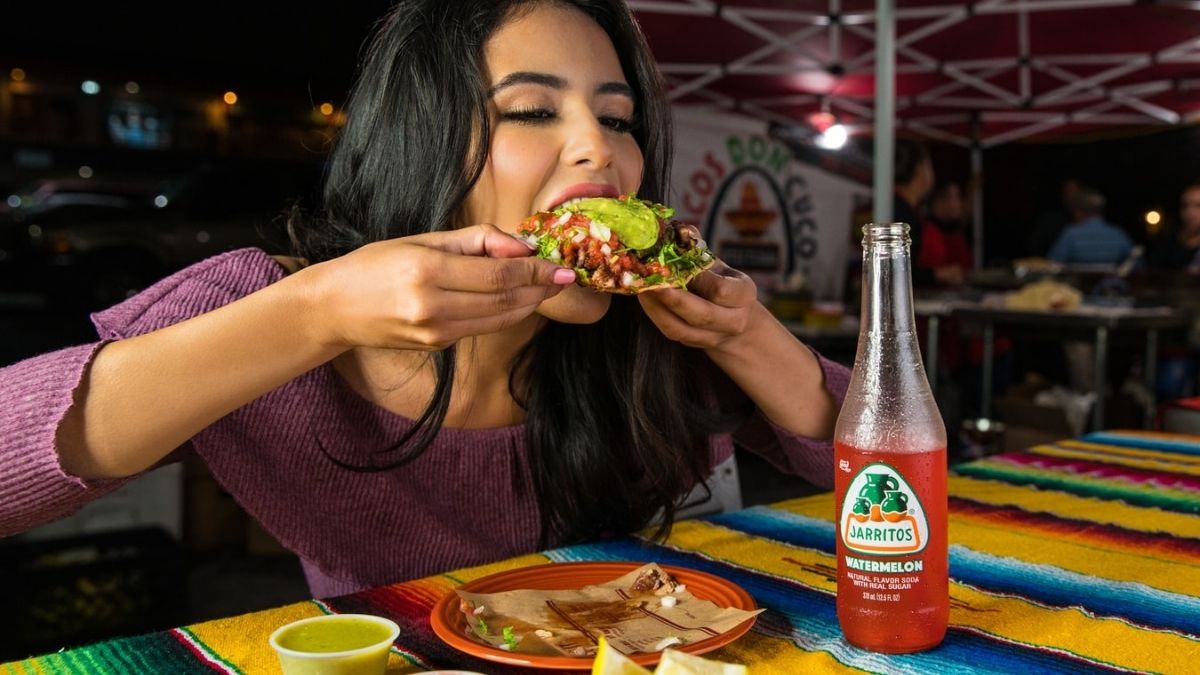 woman eating tacos