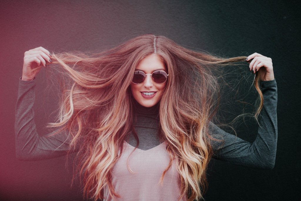 woman touching her hair