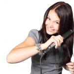 woman styling hair