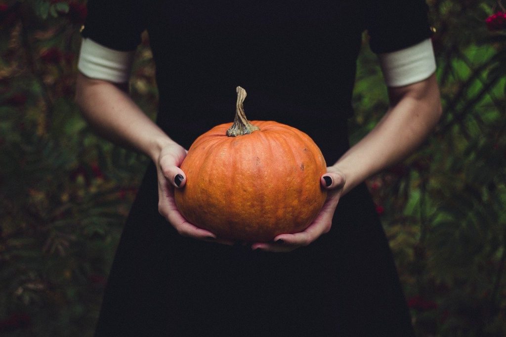 holding pumpkin