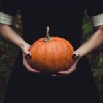 holding pumpkin