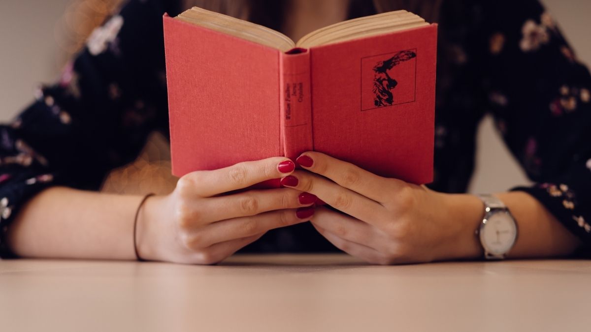 woman holding book