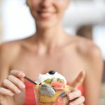 woman eating yoghurt