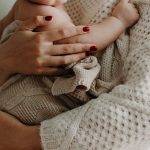 mom hugging baby